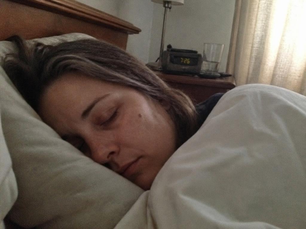 A woman sleeping peacefully at dawn